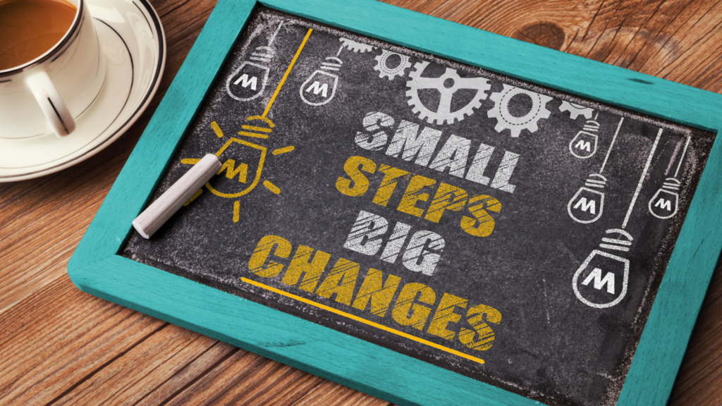 small chalkboard on a desk saying small steps big changes